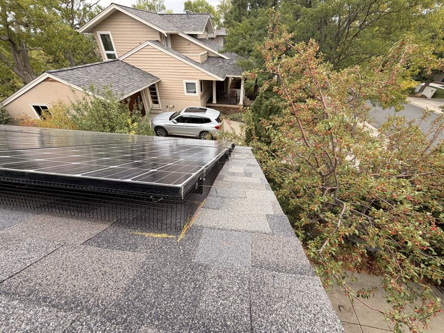 Finished critter guard mesh installation around solar panels